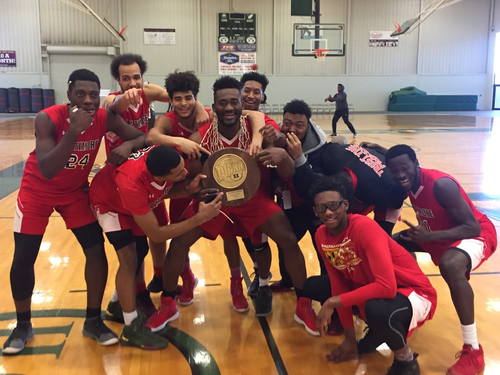Eric Okenchi celebrating with his college teammates, holding a regional championship plaque with the net around his neck